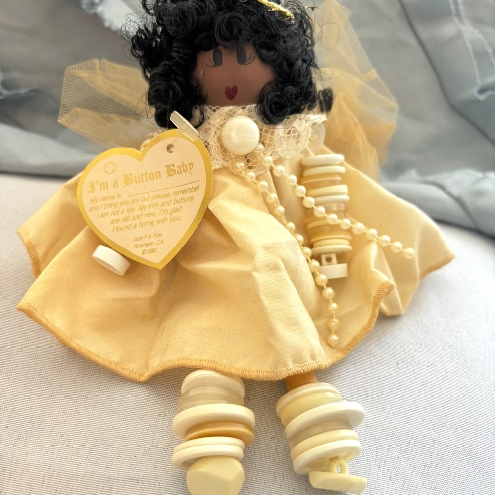 Yellow Button Baby Doll with Black Hair